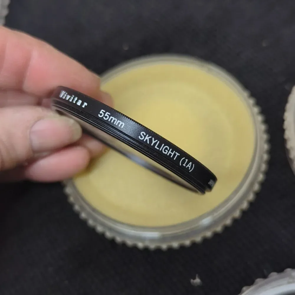 collection of camera lens filters, likely used‎ for photography